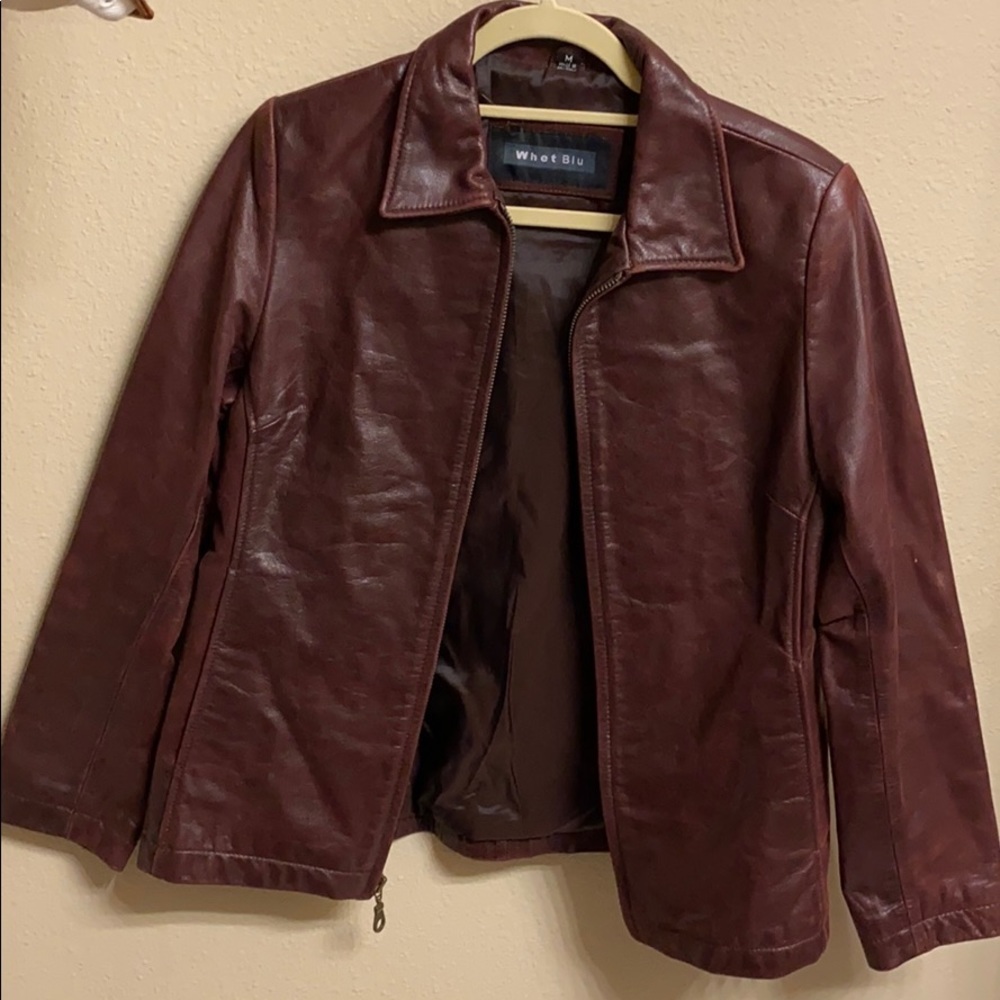 Lightly used reddish brown zip up leather jacket